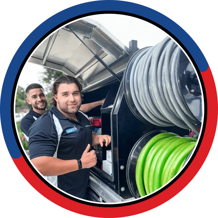 Plumbing team standing with the van line-up